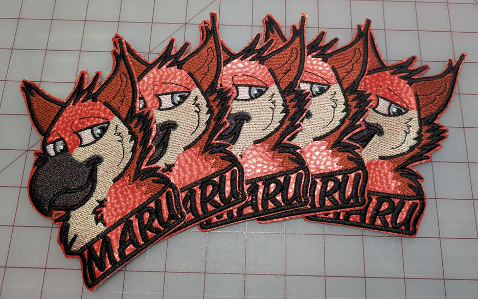 Untitled A slew of red-orange gryphon patches with the name "Maru" under all of them
